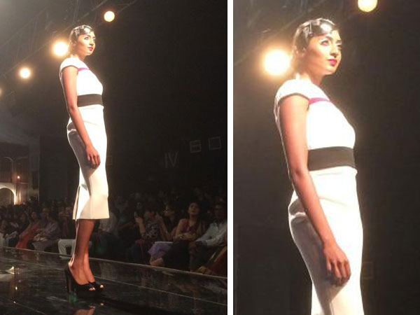 கருப்பு பெல்ட் கொண்ட வெள்ளை நிற மோனோகுரோம் உடை 